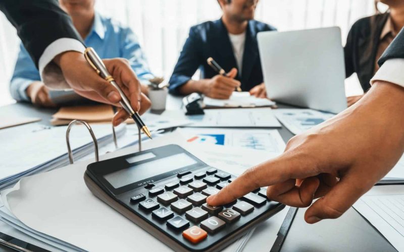 Accounting company provide finance and taxation for profit income. Insight Auditor and accountant team working in office, analyze financial data and accounting record with calculator. Accounting company provide finance and taxation planning for profitable cash flow. Insight