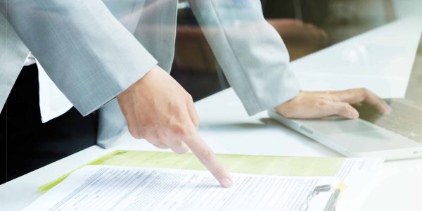 Business man working at office with laptop and documents on his desk, consultant, analize business situation. Senior official checking work. Business office situation.