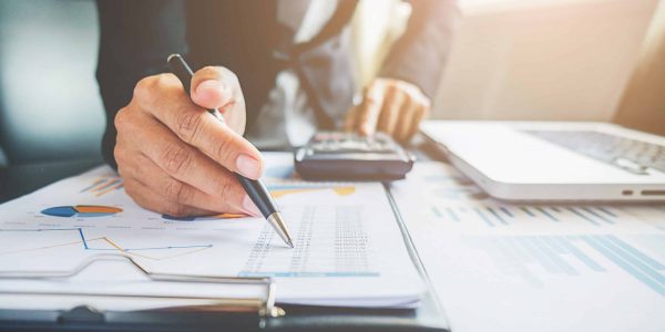 Business concept. Business people discussing the charts and graphs showing the results of their successful teamwork.